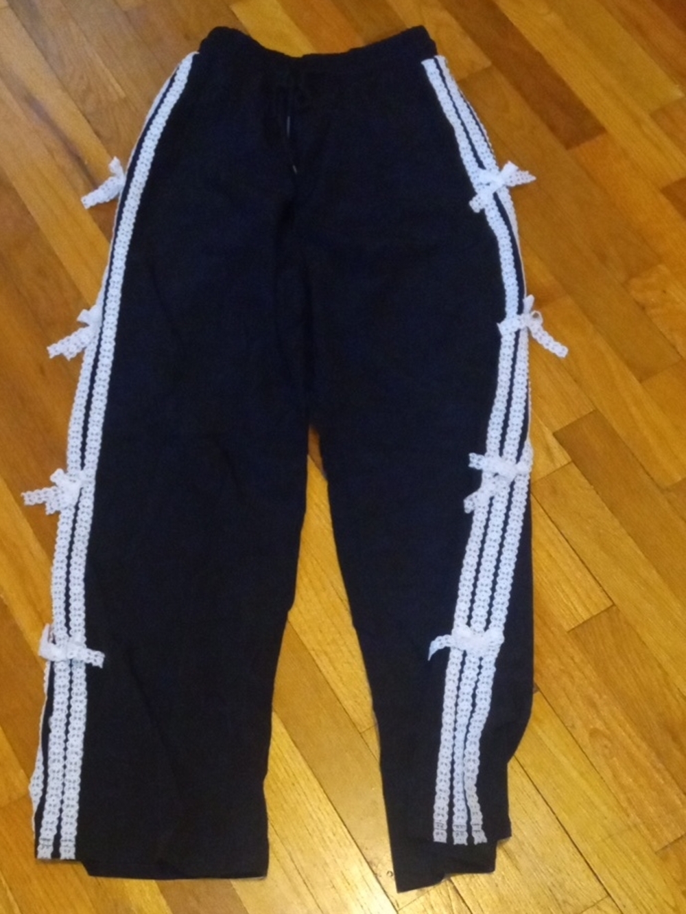 Juniors med black pants, white lace accent side panels, elastic waist